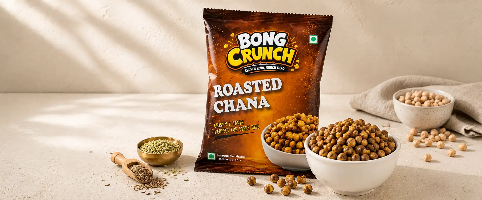 Roasted Chana packet on dark slate with bowls of roasted chickpeas